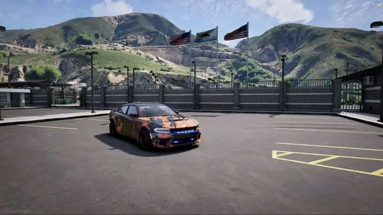 Cars parked at a hilltop overlook